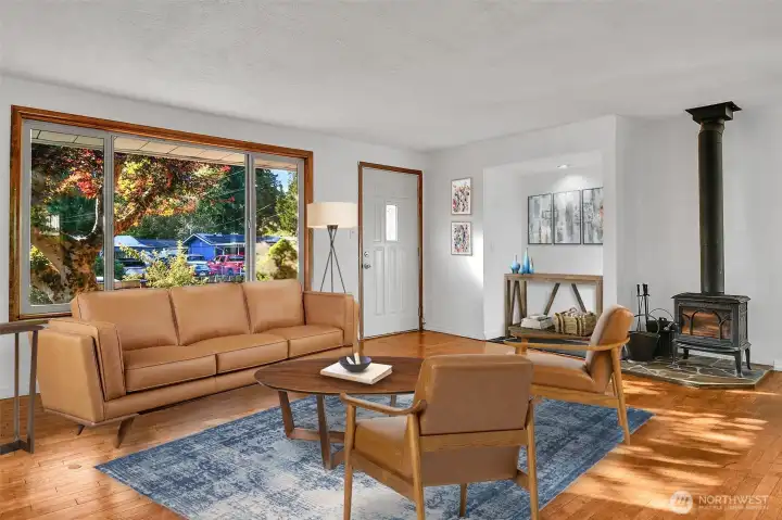 Beautiful wood floors and warm wood burning stove.