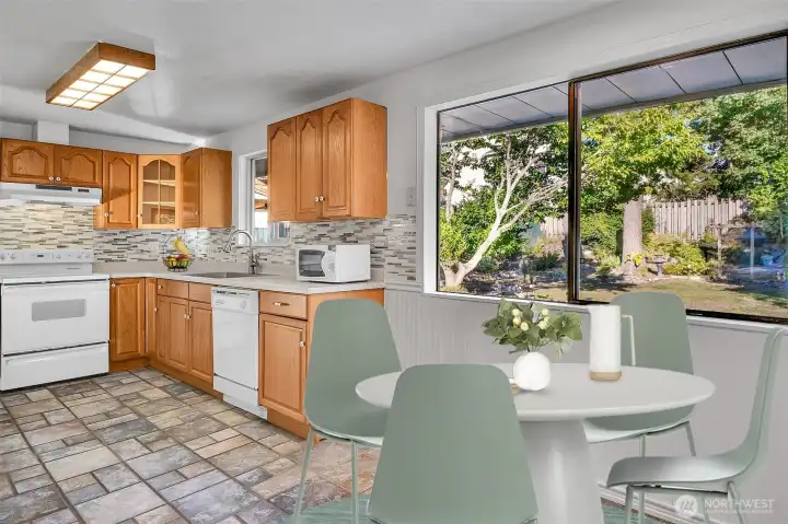 Large kitchen looks out onto the backyard.