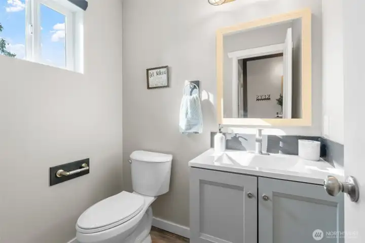 Downstairs half bathroom off the entry.