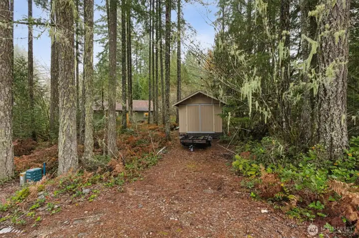 View from the road of your amazing shed, with power and its own driveway.