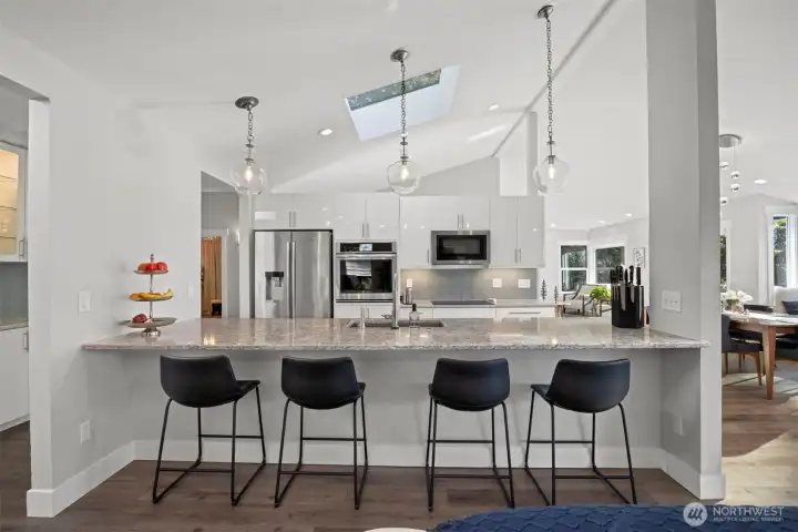 Entertain in style with a welcoming eat-up bar and lake views.