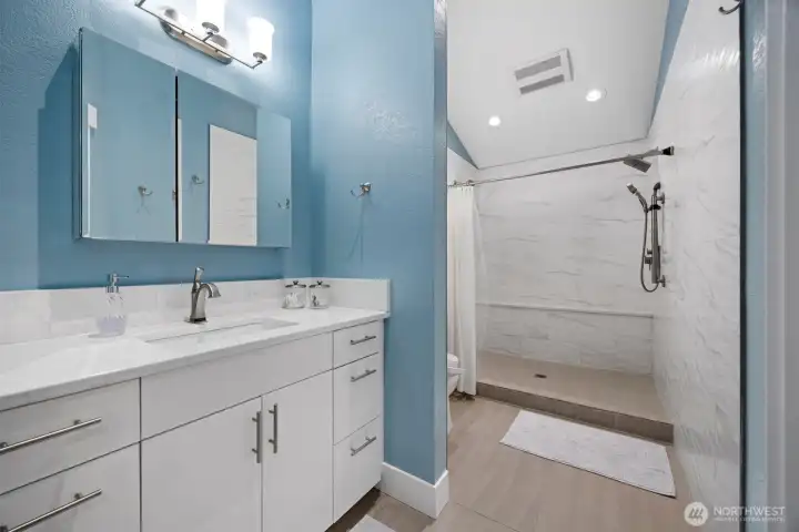 Primary ensuite bathroom renovated in 2018 with dual shower heads and bidet.