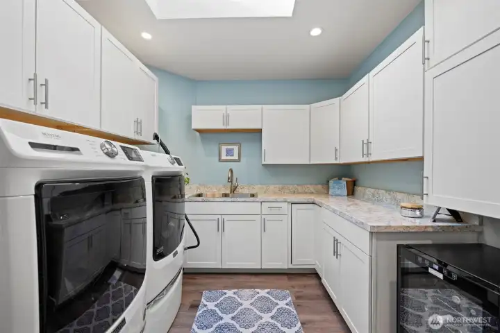Spacious laundry room room on the main level with access to the garage.
