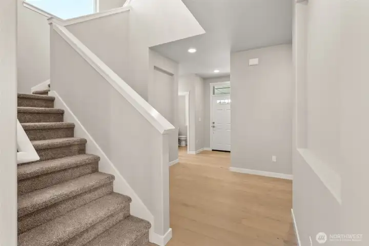 Dramatic entryway with vaulted ceilings and art niches on walls definitely make a statement!