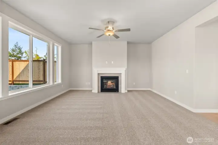 Expansive windows and nine-foot ceilings create great natural light in living room.