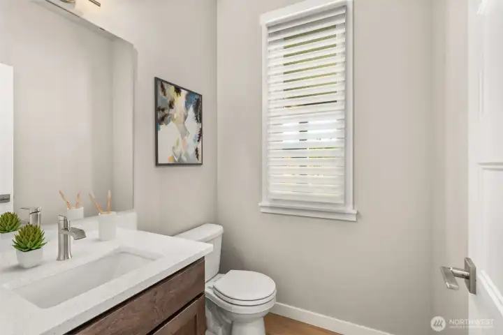 Virtually staged half bath for illustration only.