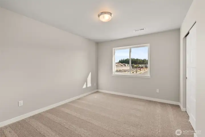Second bedroom features a reach in closet