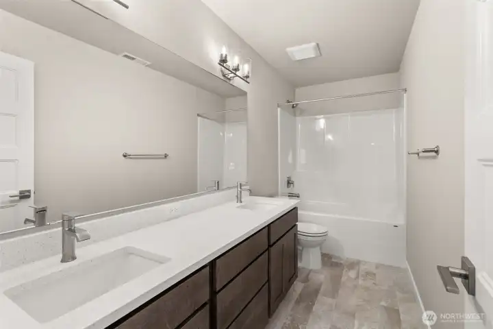Second floor hall bath with a dual vanity