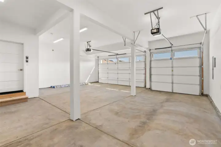3 bay garage features overhead door openers, eight-foot garage doors and primed walls for a more finished look.