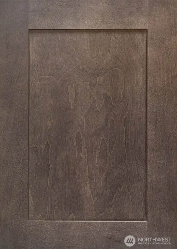 Charcoal-stain Shaker style Maple cabinets throughout.