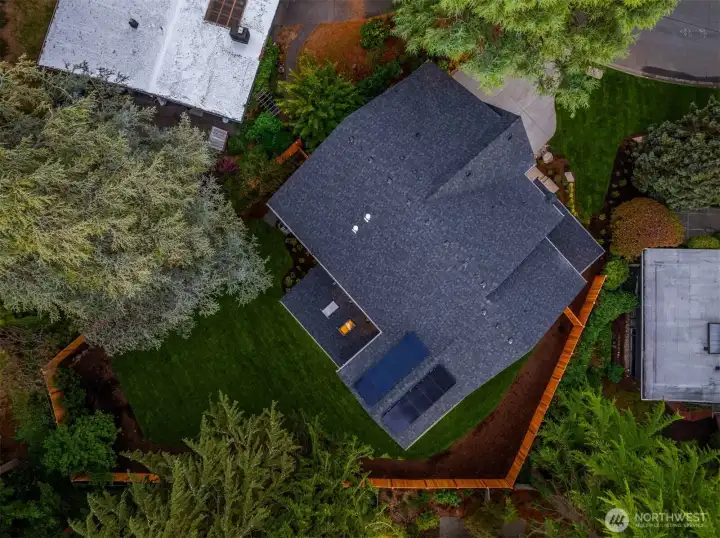 This home contains solar panels. The photo shown above is from a different MN Custom Home with a similar solar array.