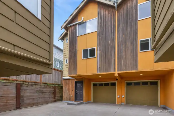 Tucked away for added privacy, this charming townhome sits quietly at the back of the community, offering a peaceful retreat from the street. The inviting front exterior features clean lines, modern finishes, and a welcoming entry that feels both secluded and serene.