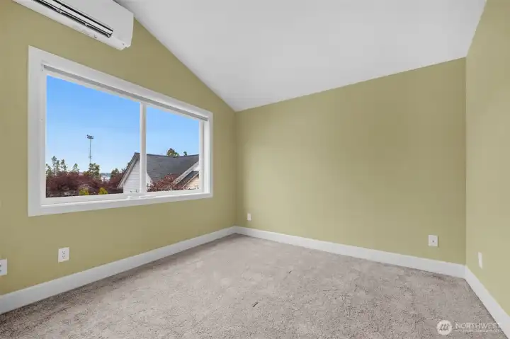 A spacious primary bedroom offers a peaceful retreat with plenty of room to relax and unwind. The private ensuite bath adds comfort and convenience, creating a well-appointed suite designed for everyday luxury and ease.