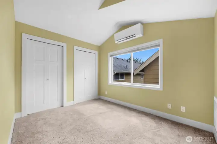 A well-appointed secondary bedroom offers ample storage and versatile space, making it ideal for guests, a home office, or everyday living. Bright and functional, it provides both comfort and practicality within a thoughtfully designed layout.