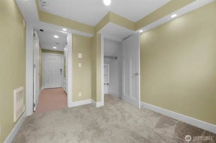 Virtual Staging  A private bottom-level bedroom offers comfort and flexibility, featuring brand new carpet and direct access to a secluded patio for seamless indoor-outdoor living. This versatile space is perfect for guests, a home office, or a quiet retreat, with a thoughtful layout that enhances both privacy and functionality.