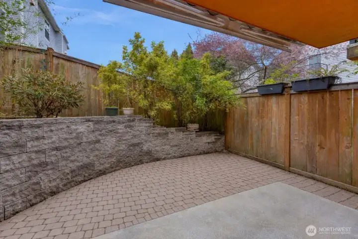 A spacious back patio offers plenty of room for outdoor dining, entertaining, and relaxing. Perfectly suited for summer gatherings or quiet evenings, this generous outdoor space extends the living area and creates an ideal setting for indoor-outdoor enjoyment.