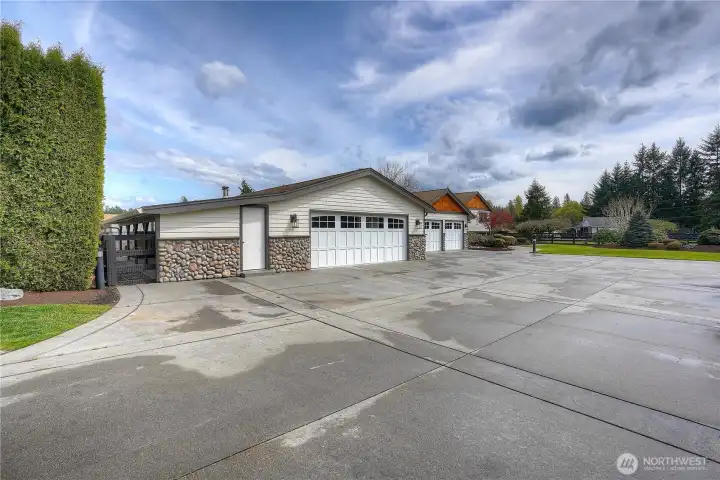 Matching two car detached garage is very spacious with workshop area, cellar and built-in cabinets