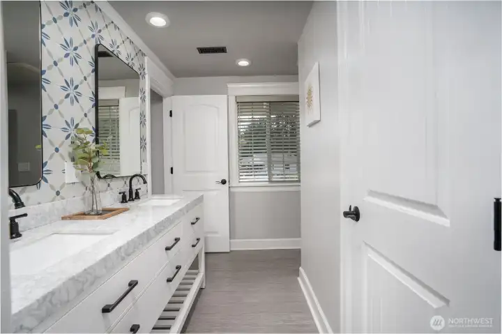 Modern Jack & Jill Full Bathroom with double vanity, custom tile wall back splash and separate water closet.