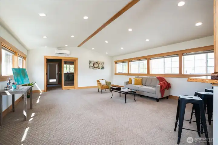 As you enter the this extended living space you will notice the light, bright and open space - complete with motorized and app controlled blinds & mini split, no detail was missed here!