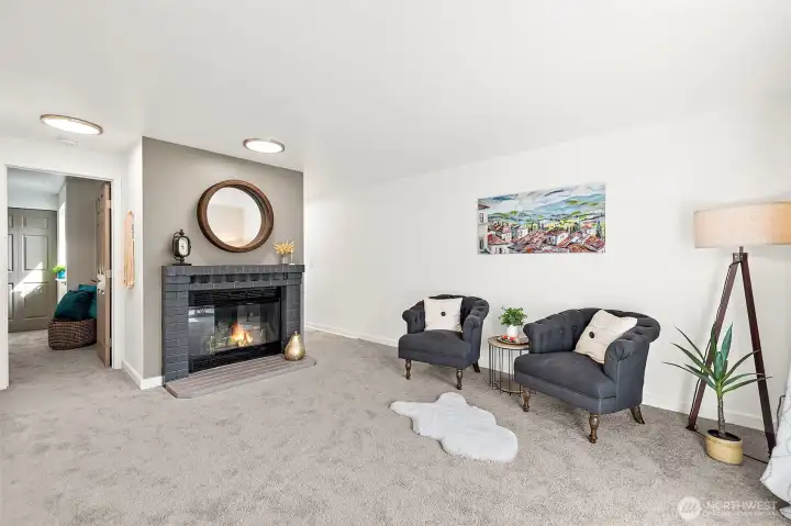 Cozy wood fireplace awaits in your living room.