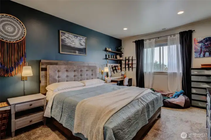 Primary Bedroom w/large picture window to take in breathtaking sunsets