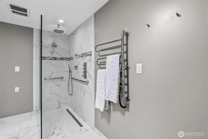 Primary bath showing heated towel rack w heated floors