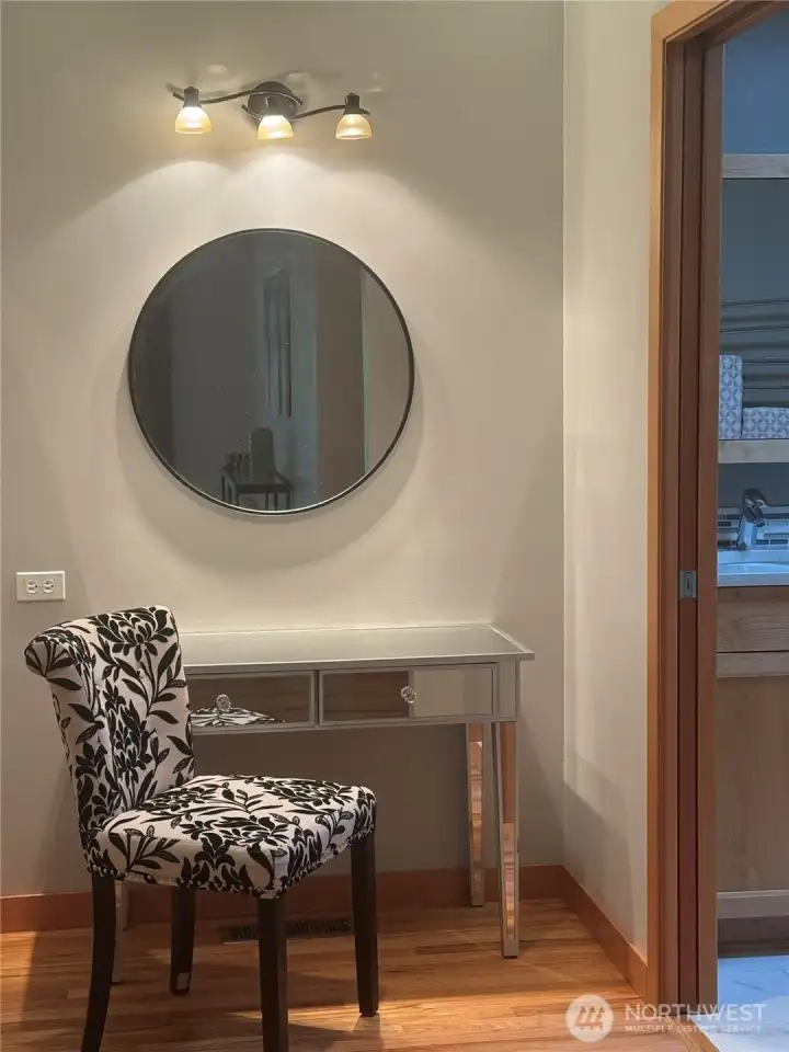 Here is the vanity in the primary suite between the closet and bathroom Here is the vanity in the primary suite between the closet and bathroom