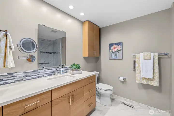 One side of the hall bath with heated floors