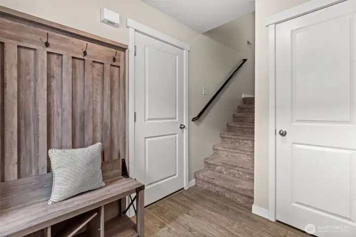 Coat closet and access to the garage and upstairs Coat closet and access to the garage and upstairs