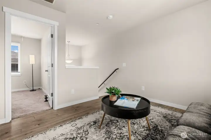 Flex space that leads into bedroom upstairs and primary Flex space that leads into bedroom upstairs and primary