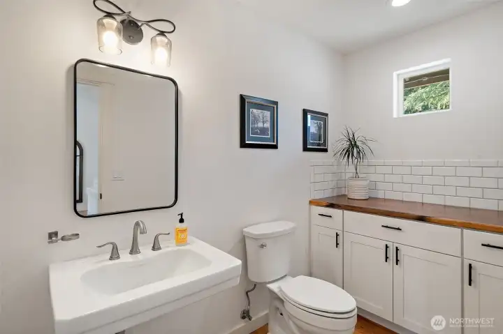 Main level powder room with plenty of storage.
