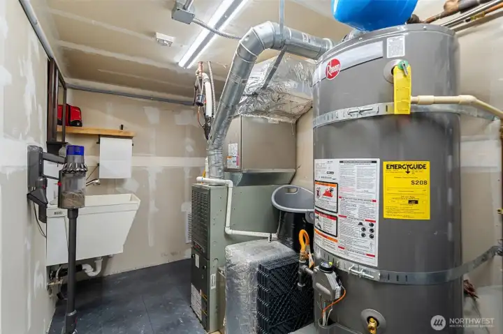 Mechanical Room off of garage complete with a deep sink.