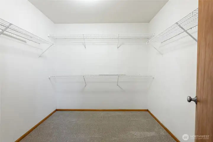 Primary walk-in closet Primary walk-in closet