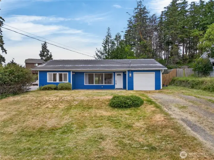 Freshly updated and full of charm, this inviting single-level home offers a spacious yard, attached garage, and room to enjoy both indoor comfort and outdoor living.