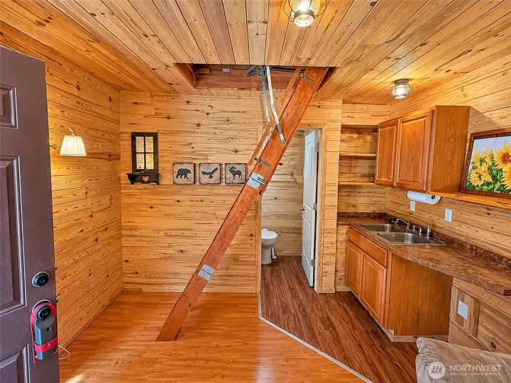 Living space with small kitchen in cabin Living space with small kitchen in cabin