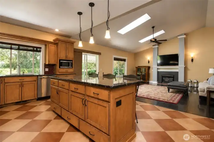View from kitchen to great room, outdoors and relaxing covered patio. View from kitchen to great room, outdoors and relaxing covered patio.