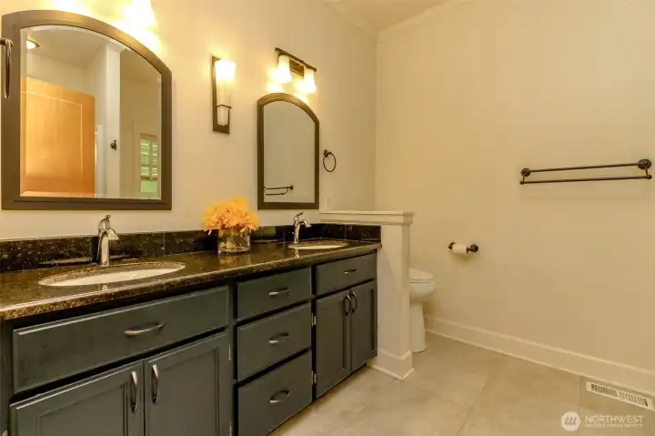 Primary bath with granite counters. Primary bath with granite counters.