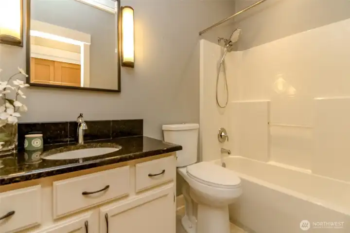 Main full bath with granite counters. Main full bath with granite counters.