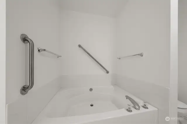 Primary bathroom with oval shaped bathtub. Future conversion to a shower?