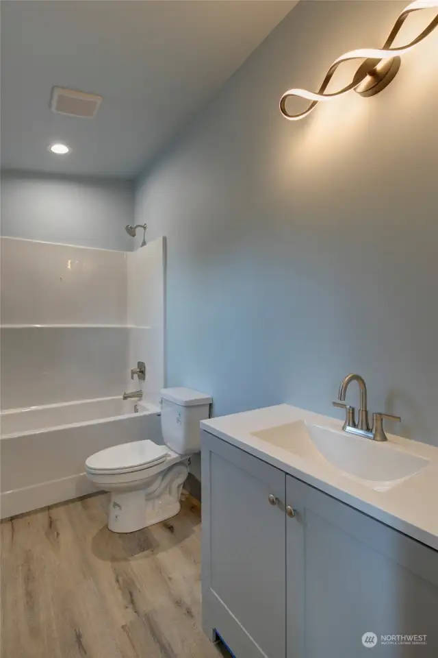 Beautiful vanity and light fixture.