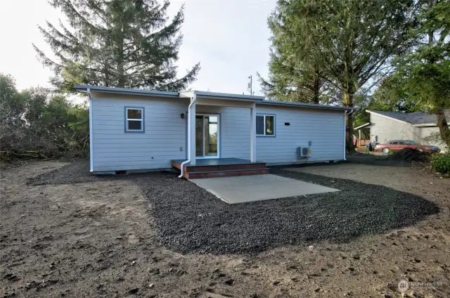 Rear of home has another large, covered deck as well as patio space!