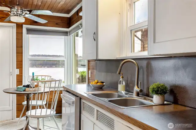 Dining nook off kitchen with an exceptional water view!