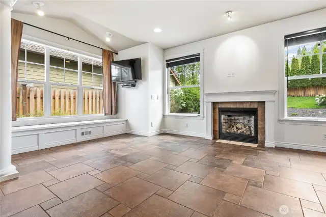 Orient your living room around the cozy fireplace. There's extra storage under the huge picture window bench.