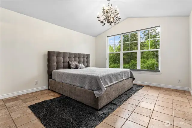 Vaulted ceilings create a bright and airy feel. That's a new custom blind, too, that can go up or down from the middle, or both.