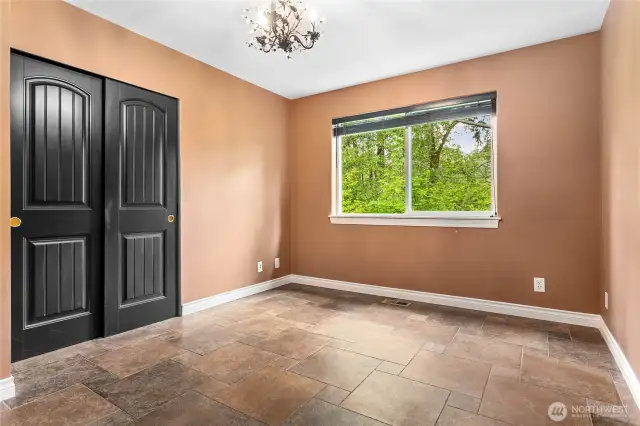 Second upper guest bedroom also looks out to the greenspace behind the house.