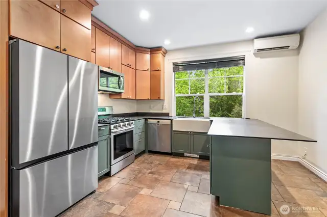Beautiful second kitchen with custom cabinets and ductless heating and cooling.