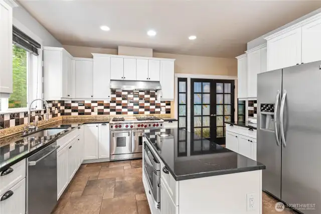 The island has a built-in microwave, additional storage, and plenty of prep space.
