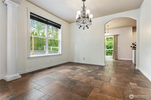 Stepping out of the kitchen, you'll find a formal dining space bathed in natural light.
