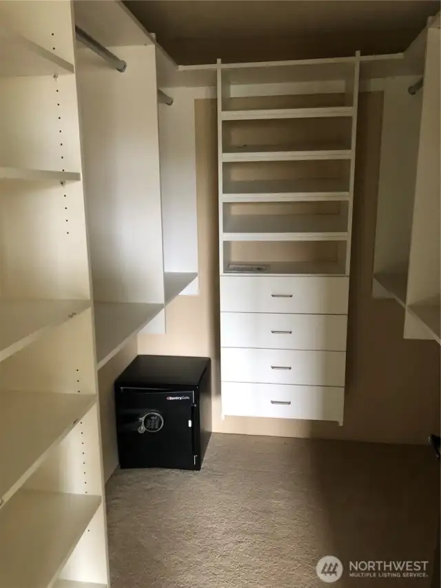 Primary closet with  safe