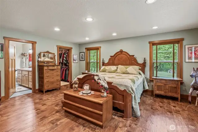 Primary Bedroom with engineered hardwood floors.
